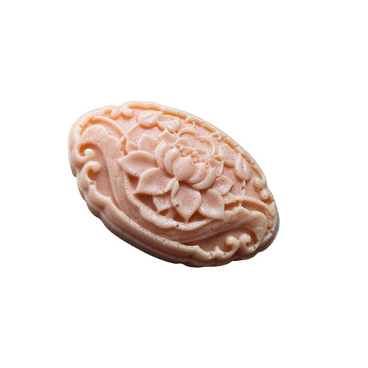 Decorative soap with intricate floral design on a white background