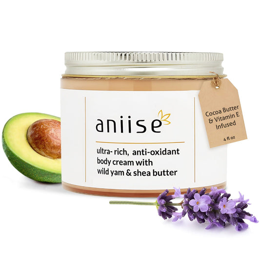 wild yam body cream jar styled with avocado and lavender sprigs