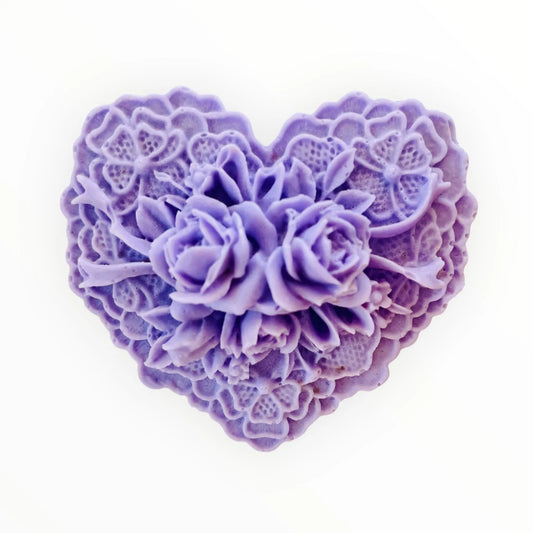 Heart-shaped purple floral soap on a white background