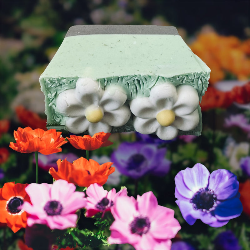 Solar-powered garden light with floral design on a background of colorful flowers