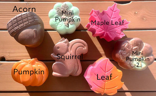 Set of autumn-themed silicone molds on a wooden surface