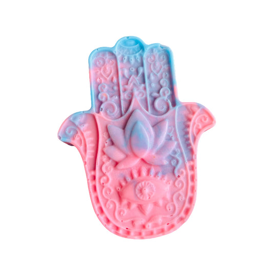 Decorative Hamsa hand mold with pink and blue design on a white background