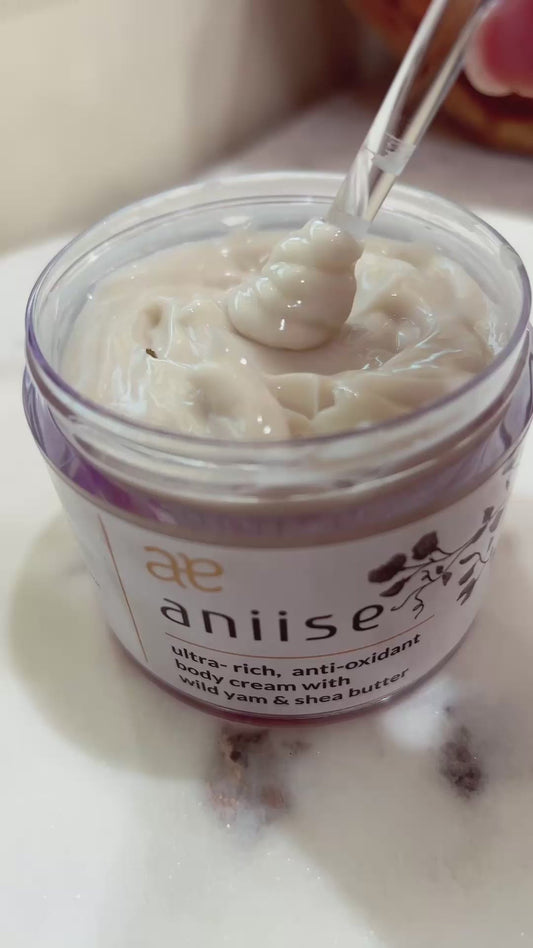 Video still showing the wild yam body cream jar and texture