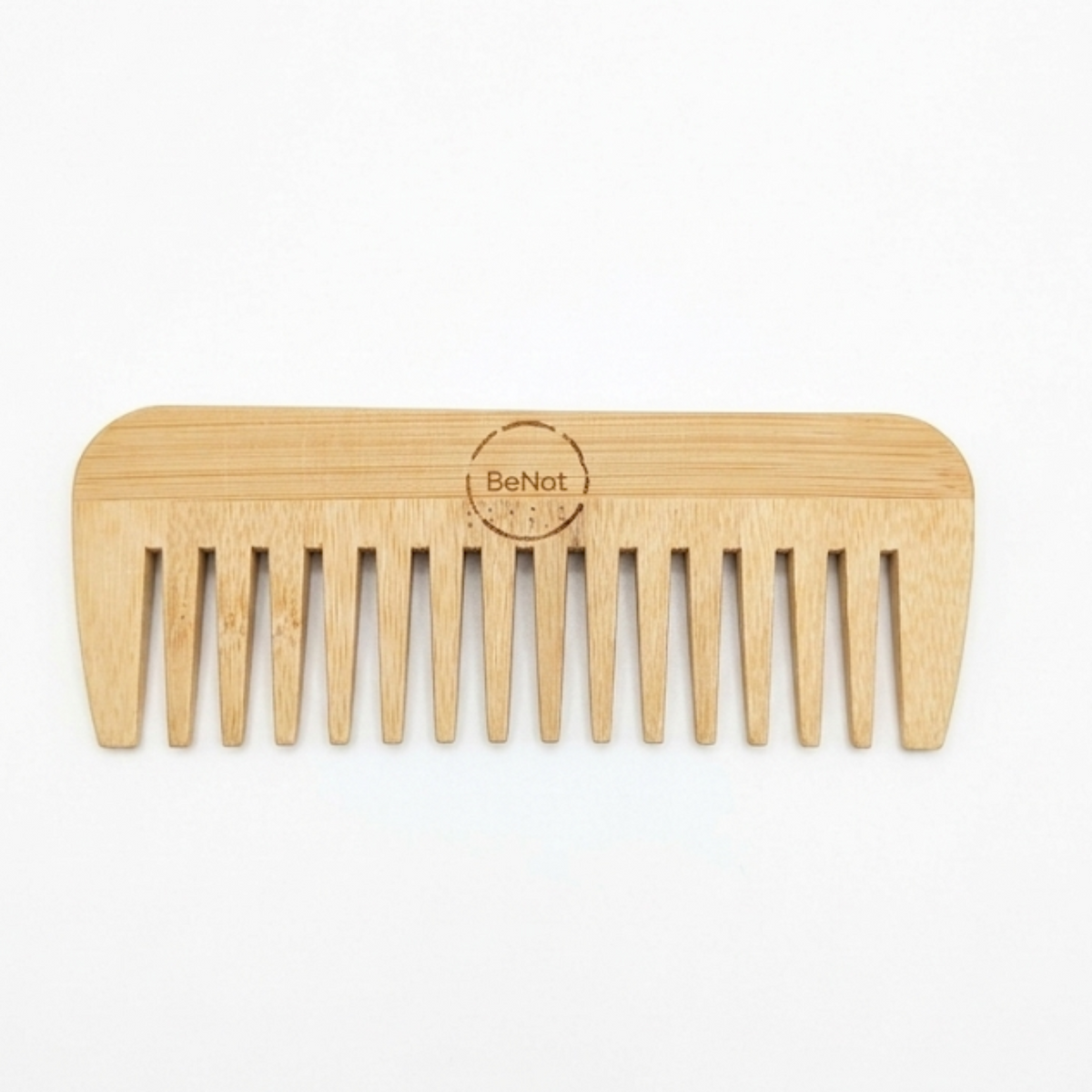 Wide-tooth bamboo hair comb on a white background