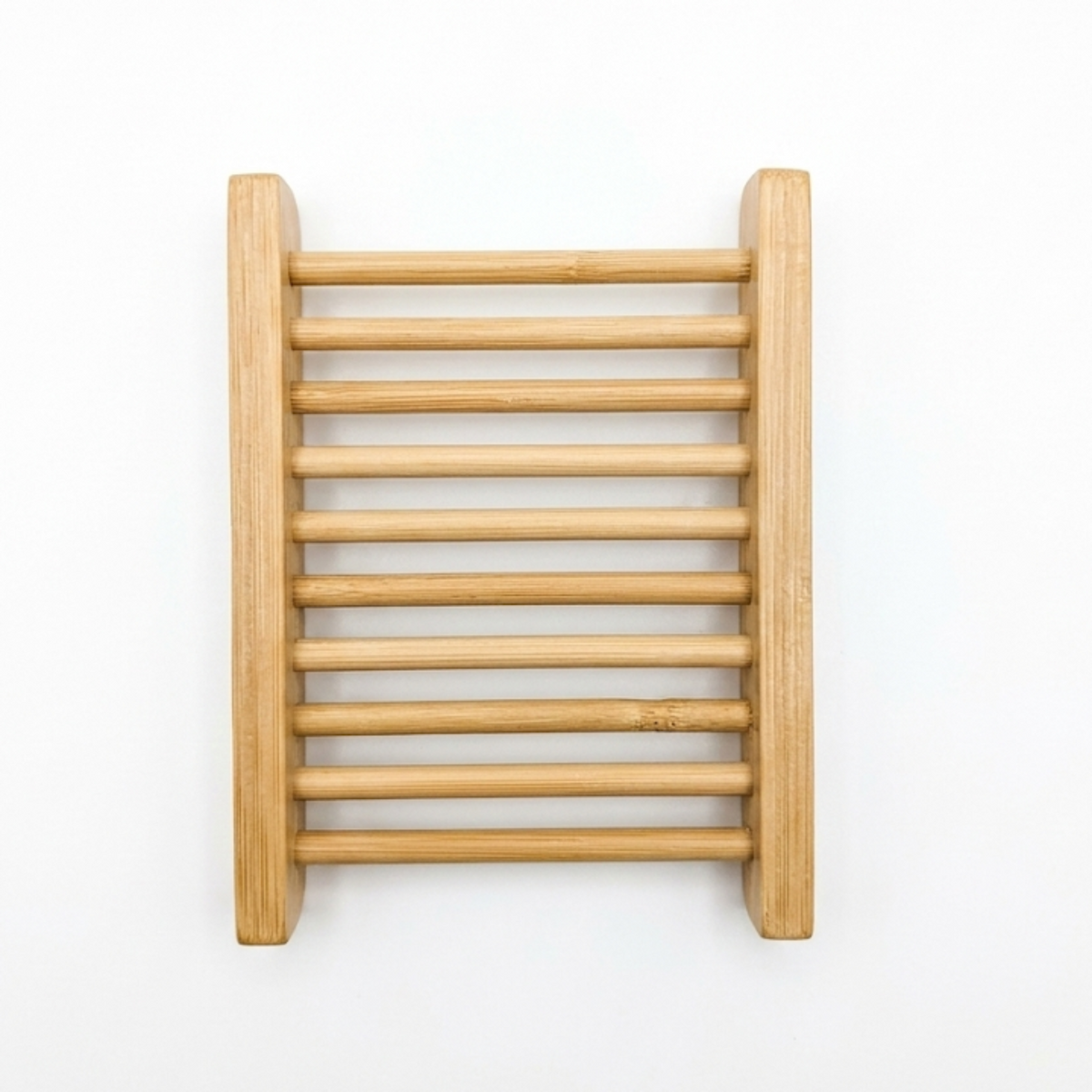Slatted bamboo soap dish on a white background